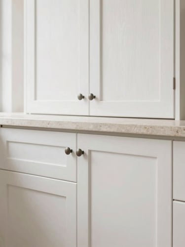 Straight-on architectural detail shot of custom white oak cabinetry meeting a perfectly aligned stone countertop, soft side-lighting, clean lines, residential interior, 35mm
