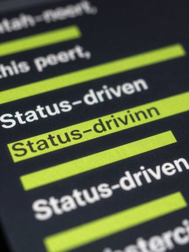 Close-up macro shot of crisp technical ad copy outputting in real-time, highlighting the Status-driven angle with electric lime underlines on a dark screen.