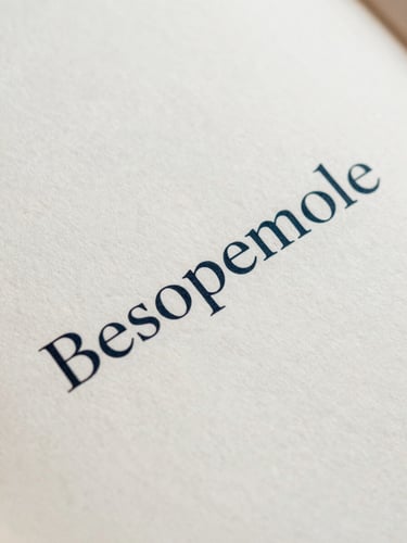 Macro shot of a printed book page with crisp serif typography, textured cream paper, soft diffused natural side-light, elegant editorial layout.