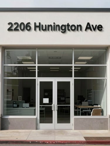 Straight-on architectural shot of a clean, clinical storefront facade at 2206 Huntington Ave, neutral overcast daylight, crisp structural lines, no dramatic shadows.