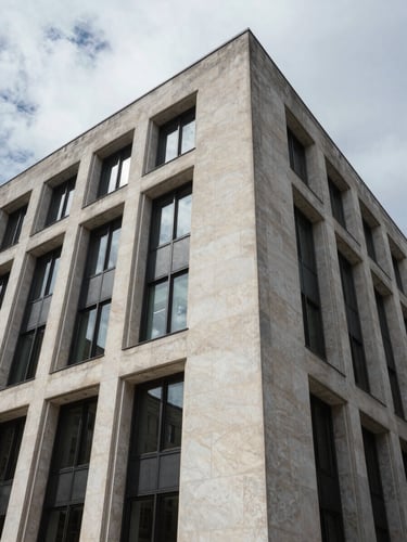 Wide-angle architectural detail of a modern financial institution's stone facade, clean geometric shadows, cool overcast daylight framing.