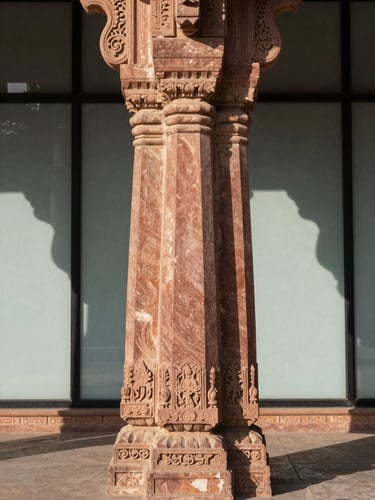 Symmetrical architectural shot of a hand-carved Jodhpur sandstone pillar meeting a clean glass wall, sharp directional afternoon sunlight casting dramatic shadows.