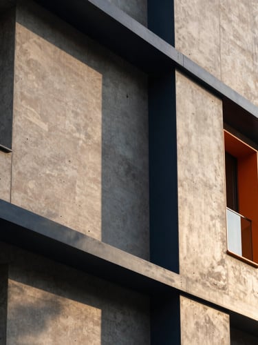Detail of modern concrete and steel facade, dramatic shadow play, golden hour light, architectural precision