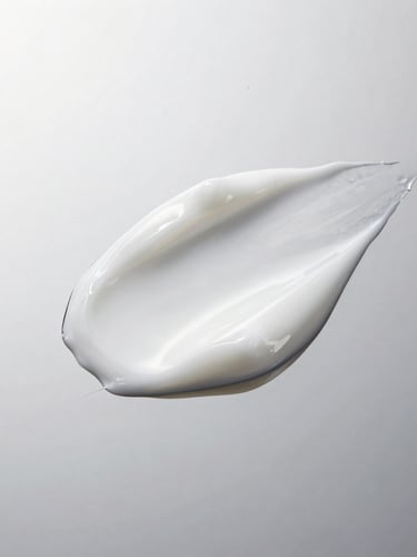 Macro high-definition shot of a rich, luxurious white cosmetic mask cream being scooped, clean reflective silver surface, high-key studio lighting, crisp focus