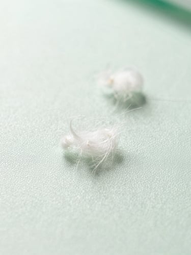 Macro shot of clean, sanitized upholstery fibers under bright natural daylight, crisp focus, showing clinical cleanliness, soft green and white tones.