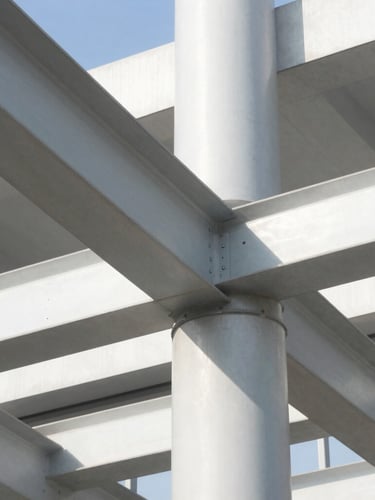 Close-up architectural detail of modern steel beams and concrete structures in bright daylight, sharp shadows, high-contrast professional framing.