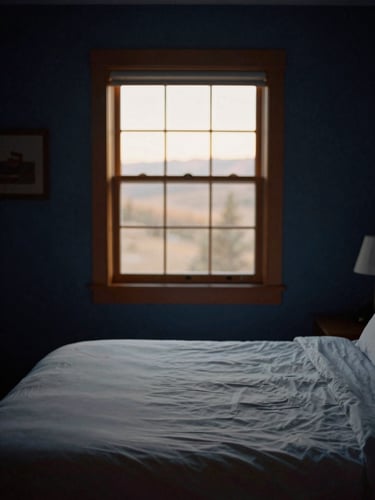 A serene bedroom sanctuary in Heber Valley, soft golden hour sunlight filtering through a window, empty made bed, 35mm photography