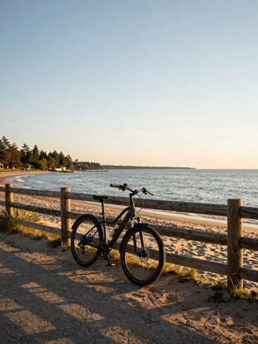 An e-bike leaning against a rustic wooden fence overlooking Prince Edward County sandy shores, golden-hour light.