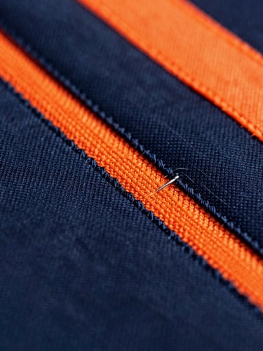 Macro shot of high-definition embroidery on heavy-duty fabric, showing tight polyester threads and precise needlework, dramatic industrial lighting, 35mm