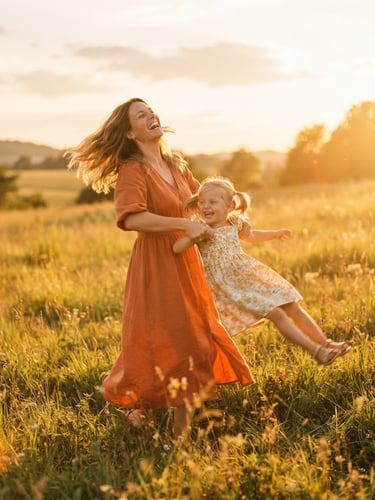 A warm sun-drenched outdoor field at golden hour, a mother laughing while spinning her young daughter, candid motion blur, soft sun flares, 35mm film style