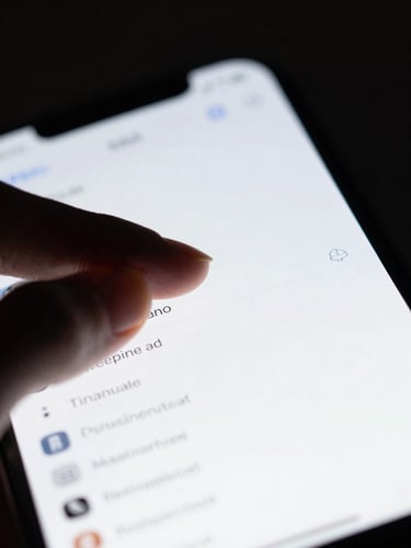 Macro shot of a hand tapping a clean, high-contrast digital ledger interface on an iPhone screen, cool studio lighting, shallow depth of field