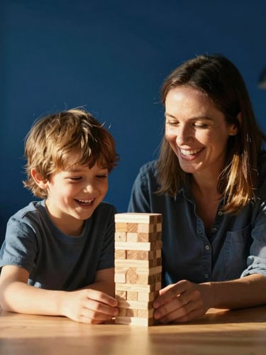 A warm, candid photo of a mother and her young son sitting together at a wooden table, laughing while building a wooden block tower, golden hour sunlight streaming through the window