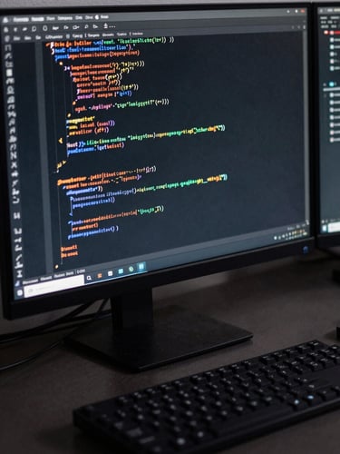 Close-up oblique angle of a developer monitor displaying dense Rust code with syntax highlighting, keyboard in foreground, high-contrast studio lighting, dark desk surface, cables partially visible