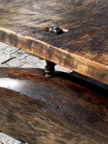 close up wood and metal detail on table by Jan Vingerhoets
