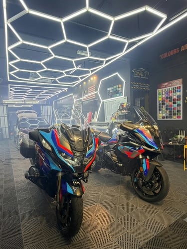 BMW touring motorcycles with matching blue red custom graphic wraps