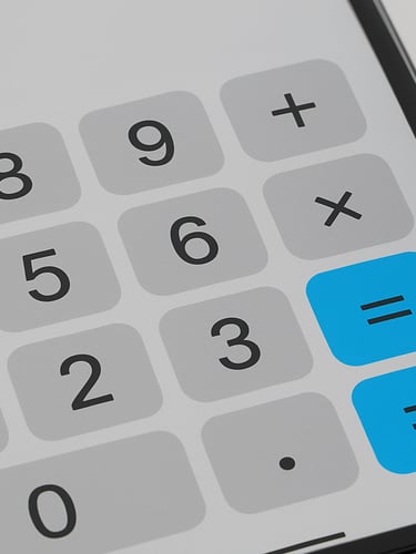 Macro close-up of a mobile screen displaying a high-fidelity tape calculator interface with bold numbers, soft natural daylight, neutral gray tones with electric blue highlights