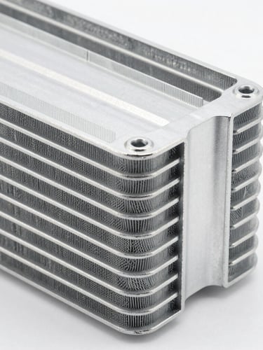 sharp industrial product photography, bright high-key studio lighting, close-up of aluminum condenser fins, clean metallic textures, 50mm lens