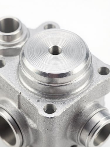 Close-up macro shot of a machined aluminum AC compressor cover cap, bright high-key studio lighting, crisp metallic details, 50mm lens.