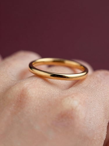 Close-up of a delicate gold ring on skin, catching soft warm natural light, deep plum background, macro details, 35mm lens