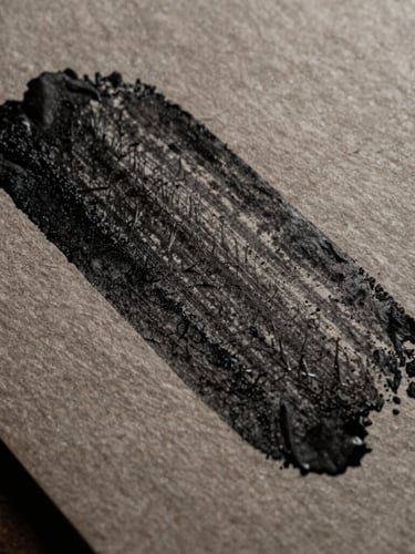 Extreme close-up of heavy black ink on highly textured raw paper stock, dramatic side lighting casting deep shadows across the grain, macro lens, desaturated rustic tones