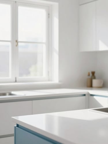 Bright high-key interior photography of a sunlit modern kitchen, crisp clean white countertops, soft blue accents, natural window daylight, sharp focus, 35mm