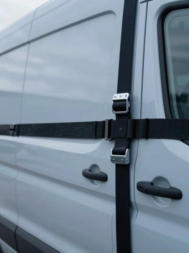 Close-up macro shot of secured cargo inside a modern Ford cargo van, clean industrial warehouse lighting, sharp focus on straps and metal anchors