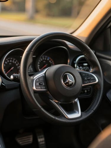 Close-up of a well-maintained car interior, warm golden-hour sunlight illuminating the clean dashboard and steering wheel, 35mm lens, shallow depth of field.