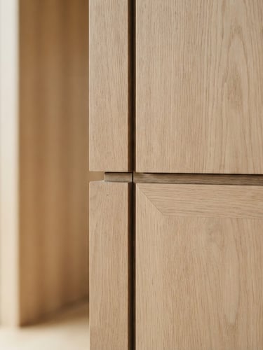 Close-up of premium light wood veneer joints, soft natural window light, architectural interior photography, high-end editorial feel