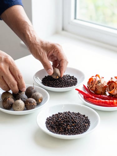 Portrait shot of hands preparing fresh Batak spices, including whole andaliman berries, torch ginger, and chili, on a clean white surface under bright natural window light, focus on the ingredients.