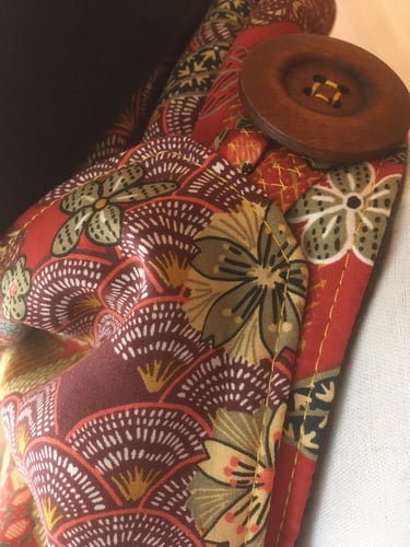 Comment fermer le col cache cou