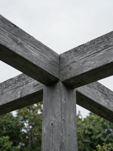 Macro architectural detail of raw sustainable timber beams intersecting, cool overcast natural daylight, desaturated slate gray tones, sharp focus.