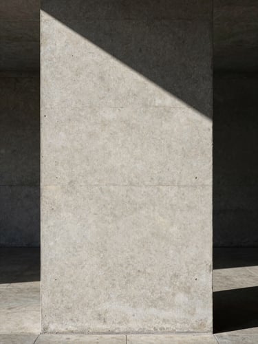 Minimalist concrete architectural column with sharp diagonal shadows cast by directional morning light, raw stone texture at the base, clean and sober composition.