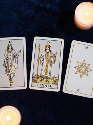 Top-down flat lay of three tarot cards with gold geometric line art on a dark velvet surface, soft candlelight casting long shadows.