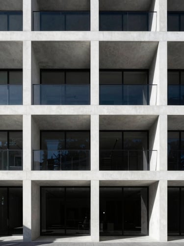 Wide shot of a modern luxury residential facade in Port Melbourne, stark white concrete, large glass panels, dramatic shadows from harsh sunlight, high-contrast, minimalist.
