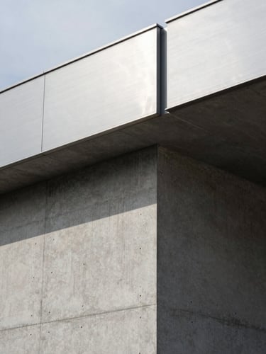 Extreme close-up of a brushed steel and reinforced concrete building facade, sharp architectural shadows, overcast daylight, minimalist structural geometry.