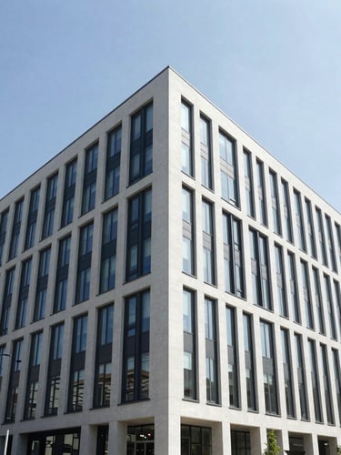 Straight-on architectural shot of a modern renovated office building, sharp angles, bright daylight, 35mm lens