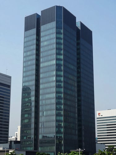 Modern high-rise corporate headquarters in Jakarta during bright clear daylight, architectural scale, professional editorial photography