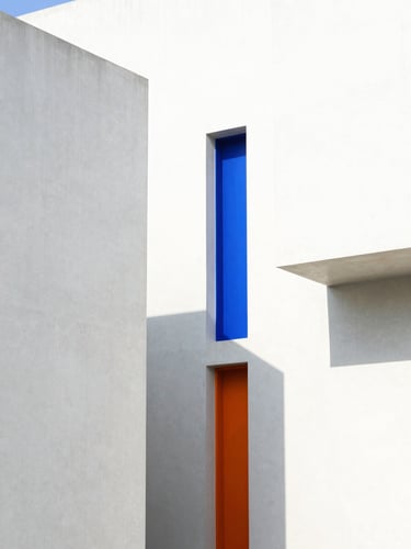 Bright high-key architectural photography of modern concrete structures with sharp geometric shadows, vivid blue accents, 35mm
