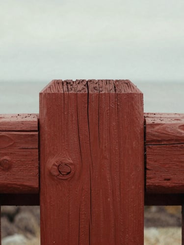Close-up detail of historic weathered redwood timbers with traditional joinery, soft coastal overcast light, tactile 35mm grain.