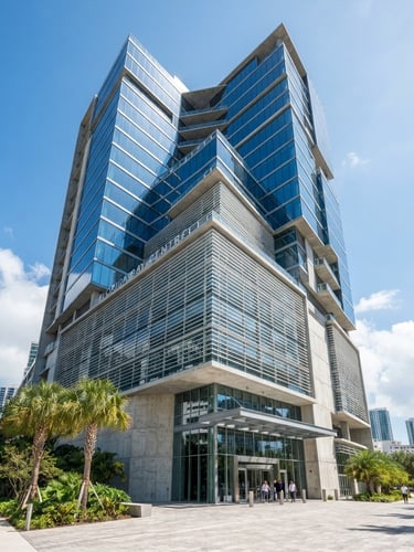 Wide-angle architectural photograph of a modern glass office building in Florida, bright natural daylight, crisp shadows, professional editorial style.