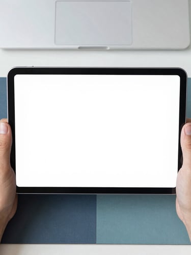 Clean overhead desk setup, hands using a tablet, bright natural daylight, soft navy and teal tones, sharp focus, modern minimalist workspace, 35mm
