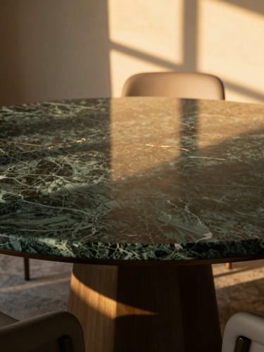 Close-up of a luxury private boardroom table made of dark green marble, warm golden hour light casting geometric shadows from window frames, minimalist and prestigious