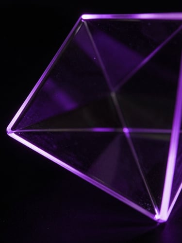 Extreme close-up macro shot of a sleek, dark glass geometric sculpture refracting intense violet light, sharp neon edge-lighting, obsidian background, low-key dramatic chiaroscuro.