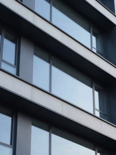 Architectural detail of a modern building facade, emphasizing clean lines and robust materials, low-contrast overcast daylight.