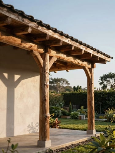 Wide environmental shot from low angle, a heavy-timber lean-to structure attached to a rendered garden wall on the left third of the frame, afternoon daylight raking across the roof cladding and casting sharp structural shadows, timber posts visible in close foreground, open garden behind receding into soft focus