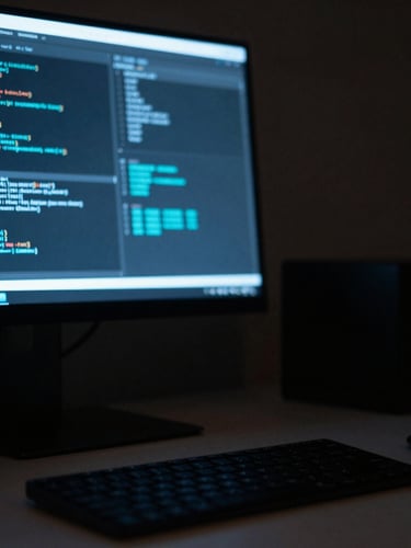 Macro close-up of a sleek minimalist desk setup at night, glowing monitor showing clean code and cyan data visualizations, low-key ambient lighting, 35mm.