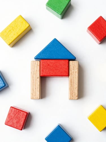 Overhead flatlay of premium unbranded wooden toy blocks and minimalist geometric shapes, bright high-key product photography, seamless white backdrop, crisp studio light, vibrant primary accents, sharp focus