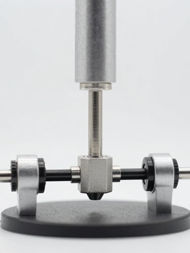 Crisp macro photography of a mechanical stress-testing rig compressing a durable product joint, bright high-key studio lighting, clean background, 50mm
