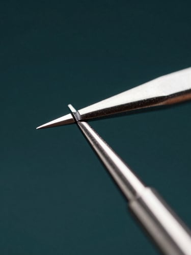 Extreme macro close-up of a surgical scaler tip, hard sterile key light reflecting off razor-sharp beveled steel edge, dark obsidian background, high-contrast studio photography.