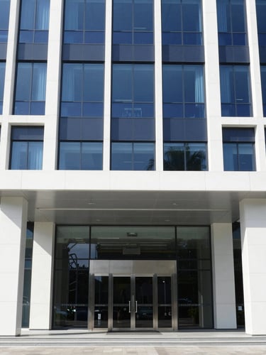 A professional architectural view of a modern corporate building entrance in Ampang, Selangor, bright clean daylight, sharp focus, 35mm